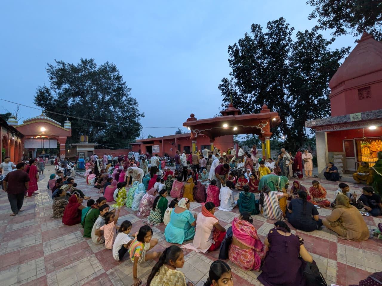 The temple courtyard and shikharas at dusk