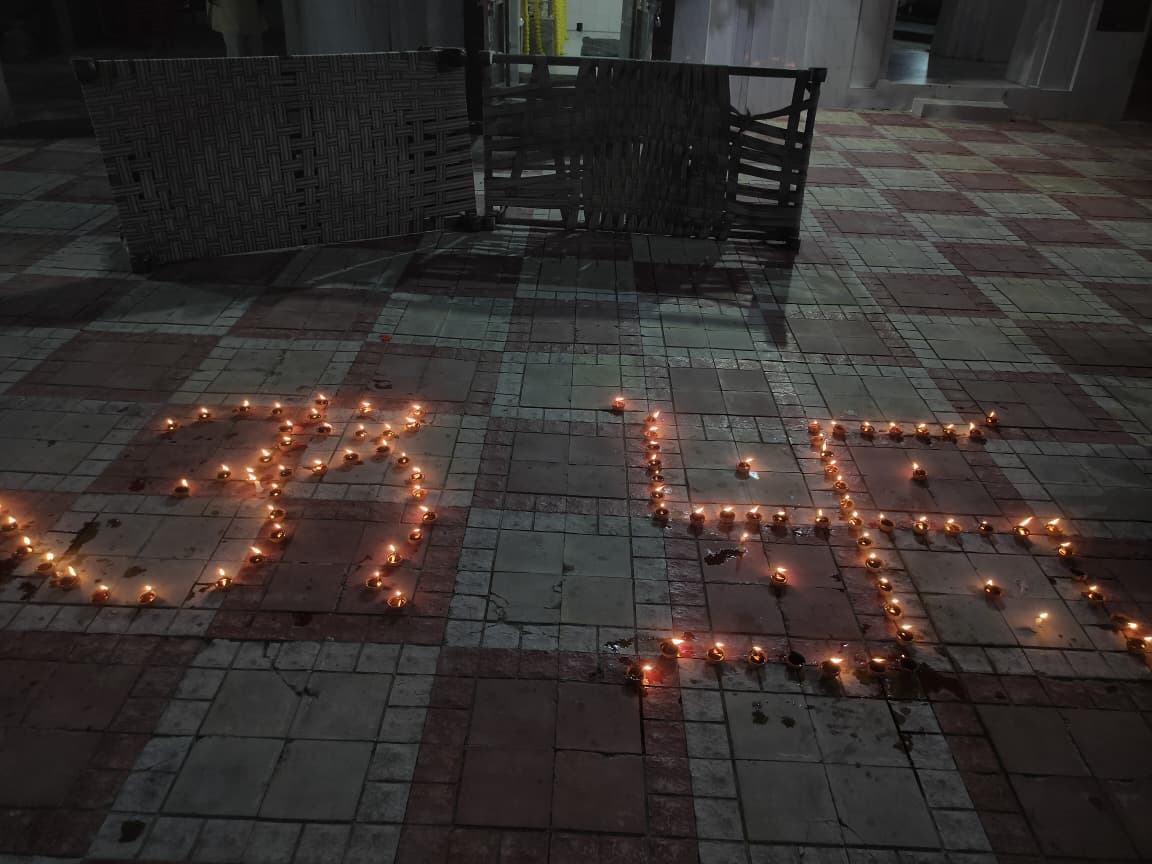 Lamps lit on the temple floor