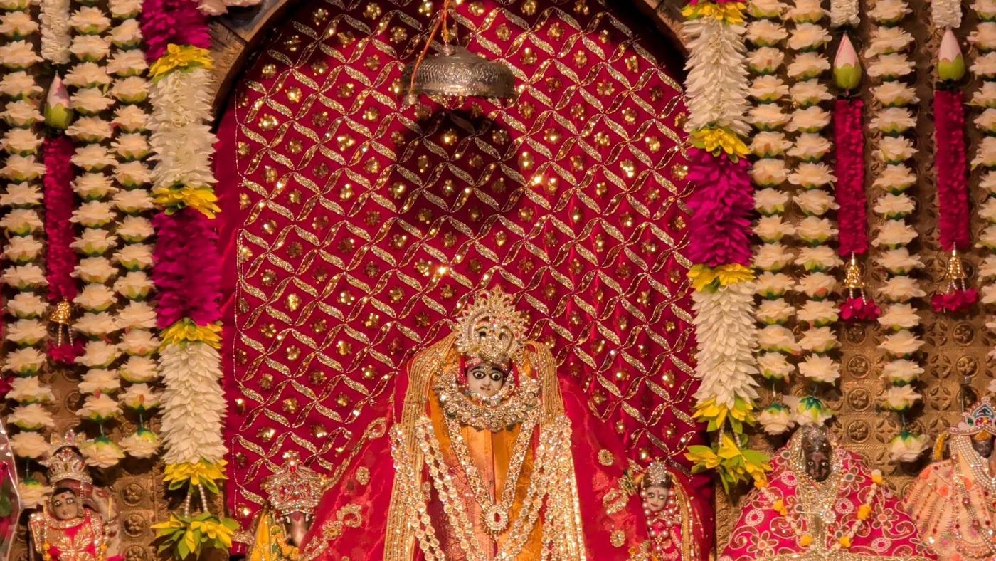 Maa Jayanti Devi in the sanctum, framed with red and white flowers