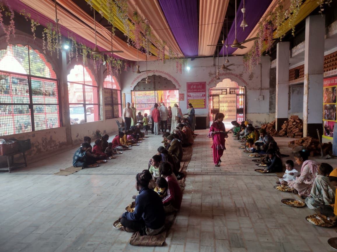 Girls seated in rows in the mandir hall