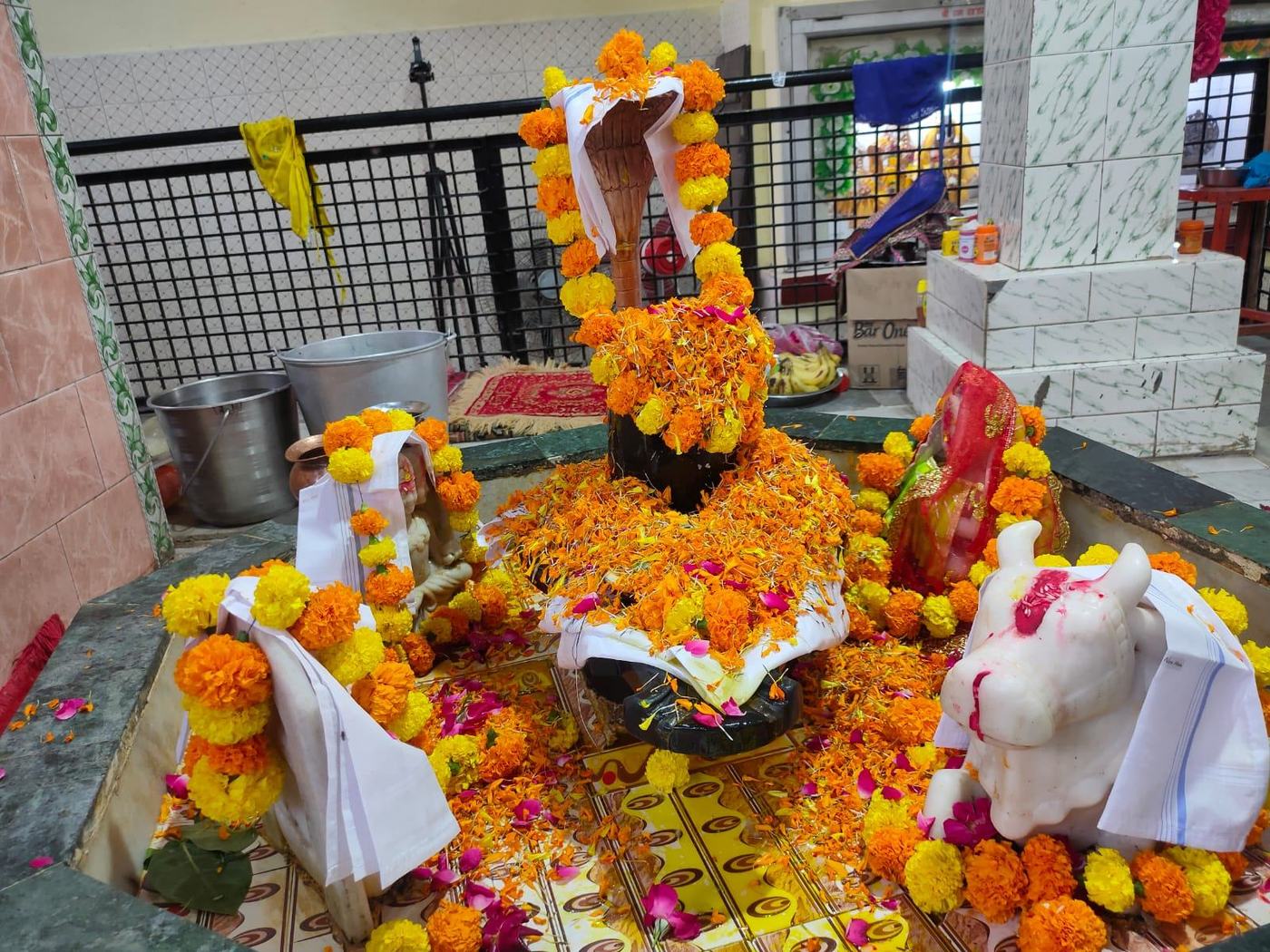 Shivling adorned with marigolds