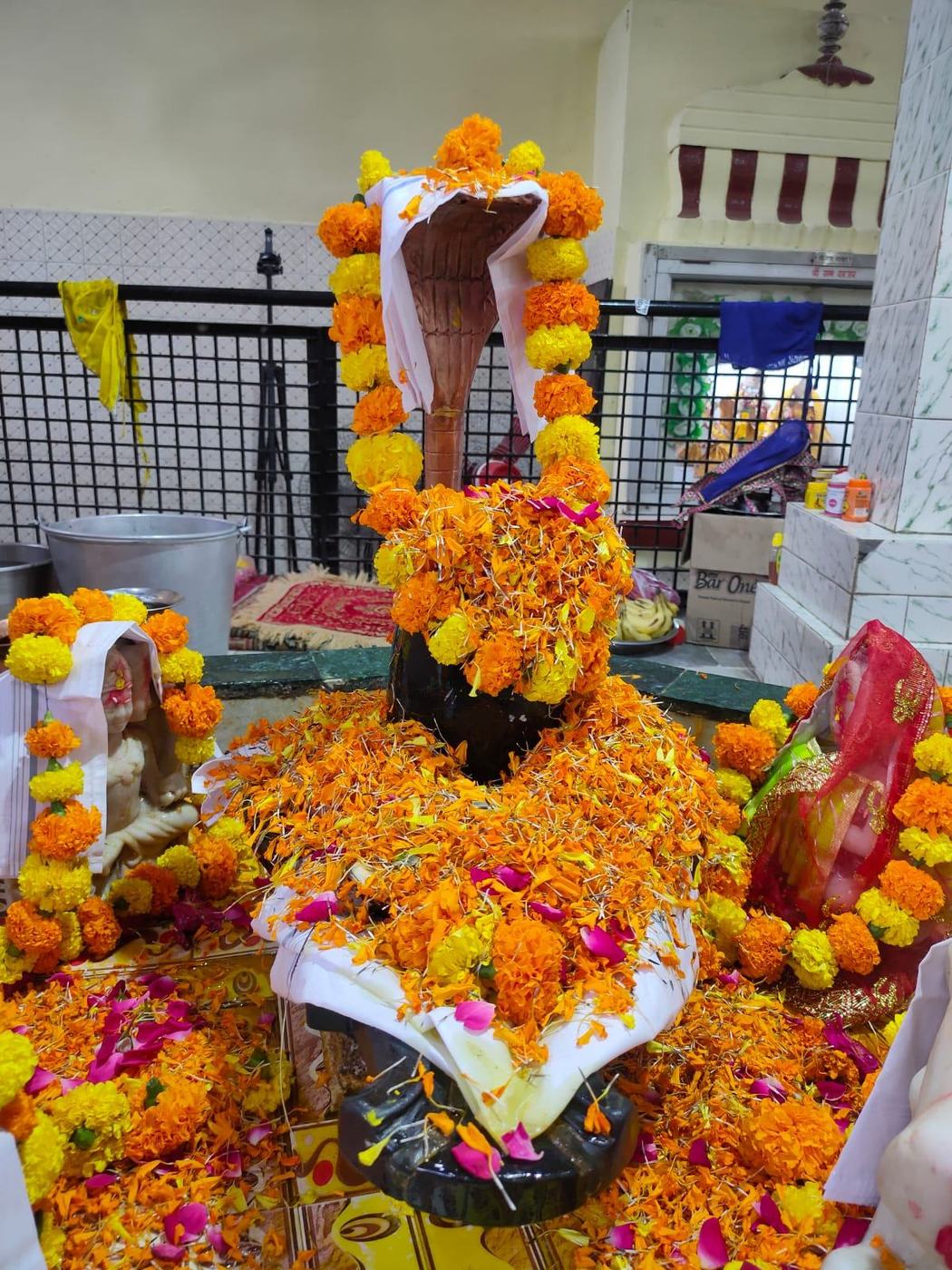 Shivling covered in marigolds